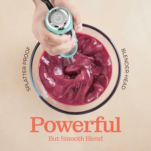 Hand blending a red smoothie in a bowl labeled 'Powerful But Smooth Blend'.